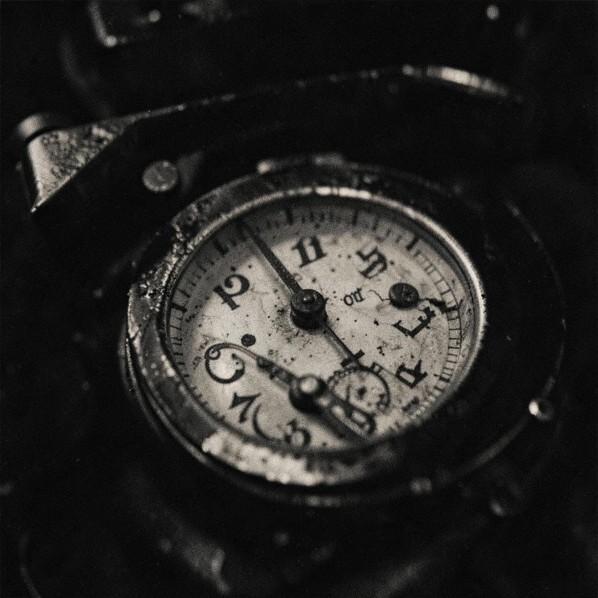 Macro detail of a worn instrument dial in dim light
